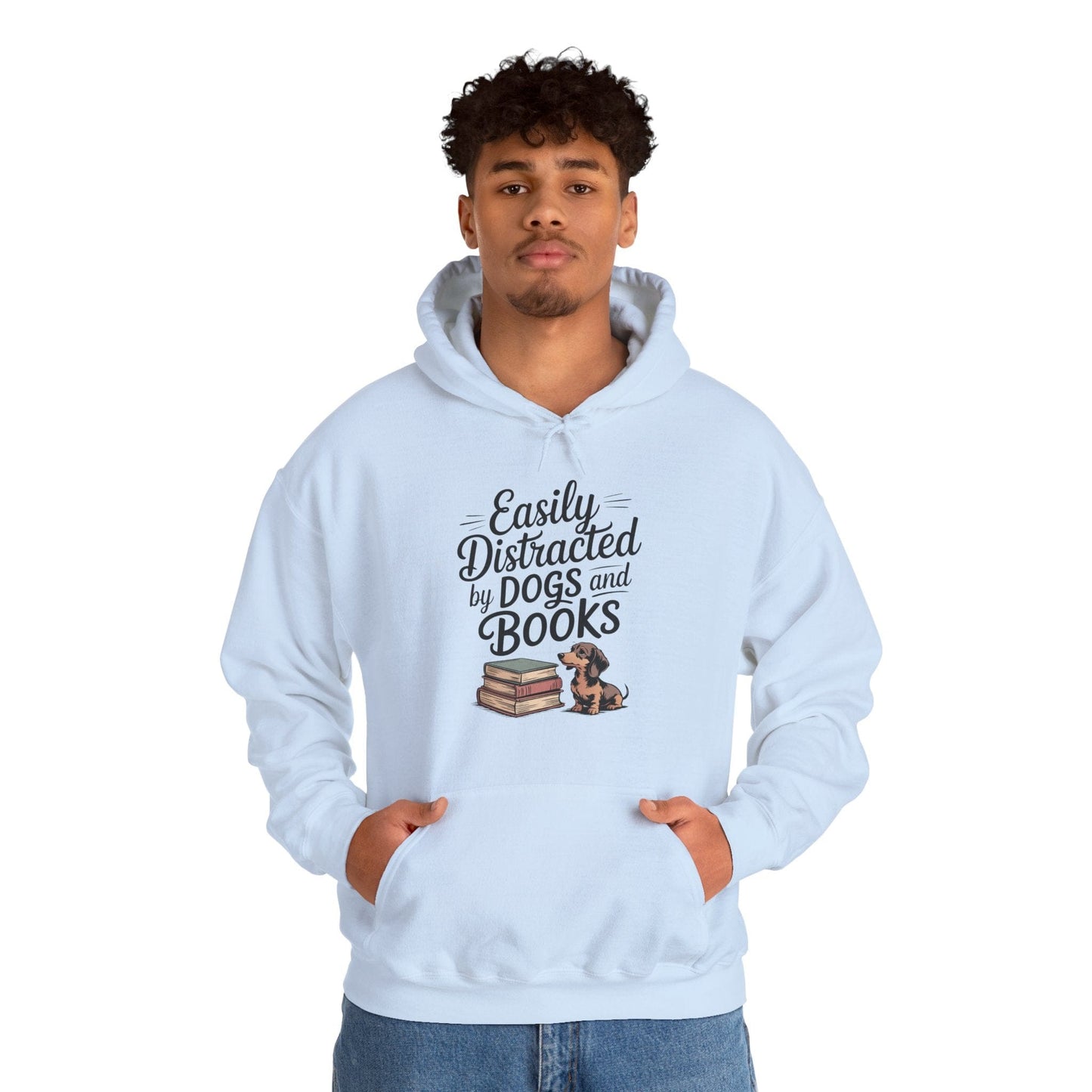 Person wearing a light blue hoodie with text and a graphic of books and a dog.