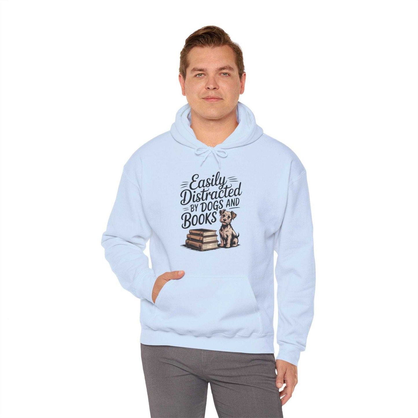 Man wearing a light blue hoodie with text and a graphic of a dog and books on a white background