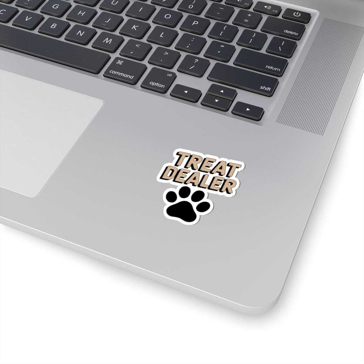 Laptop with a 'Treat Dealer' sticker featuring a paw print on the palm rest area.