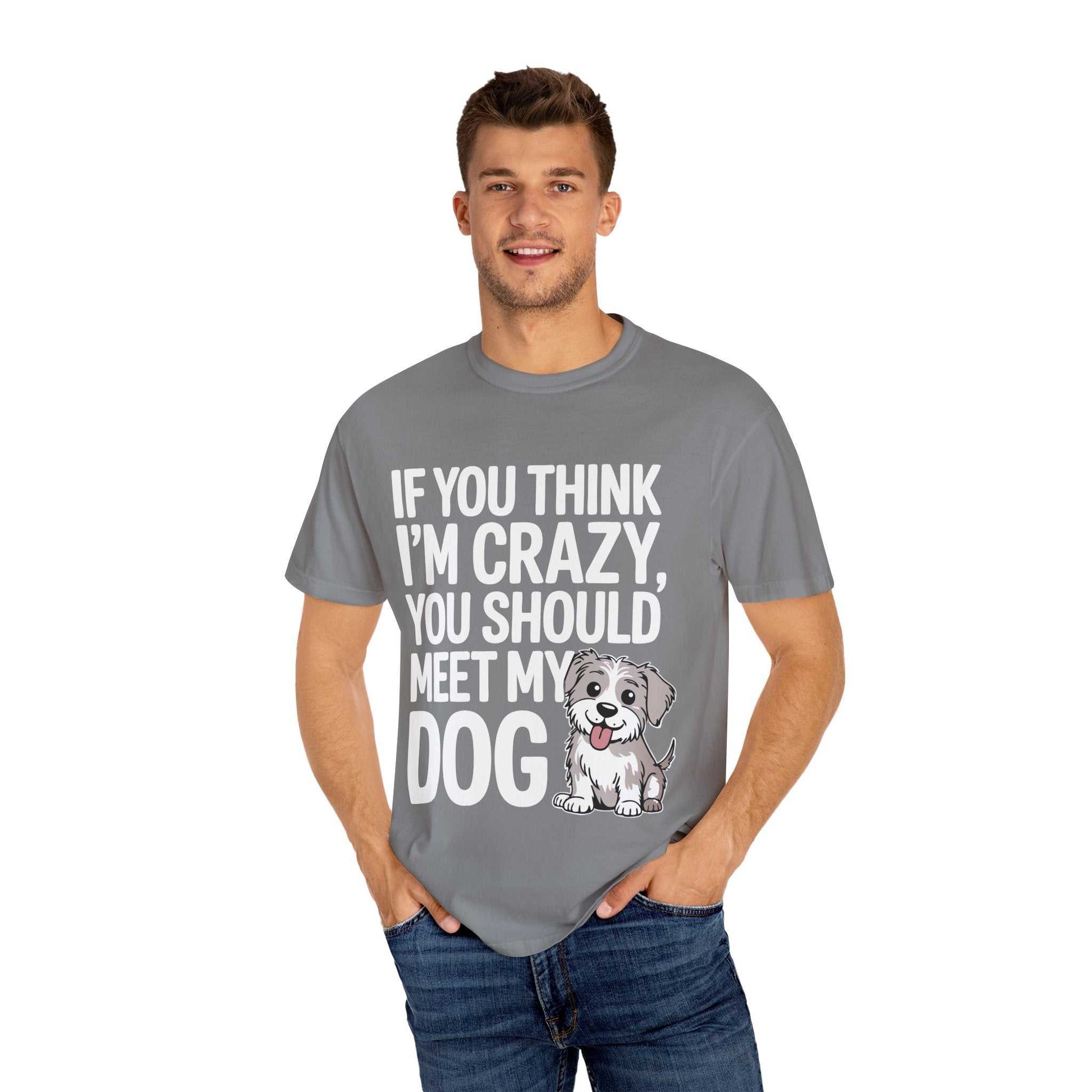 Man wearing a gray t-shirt with a dog graphic and text on a white background