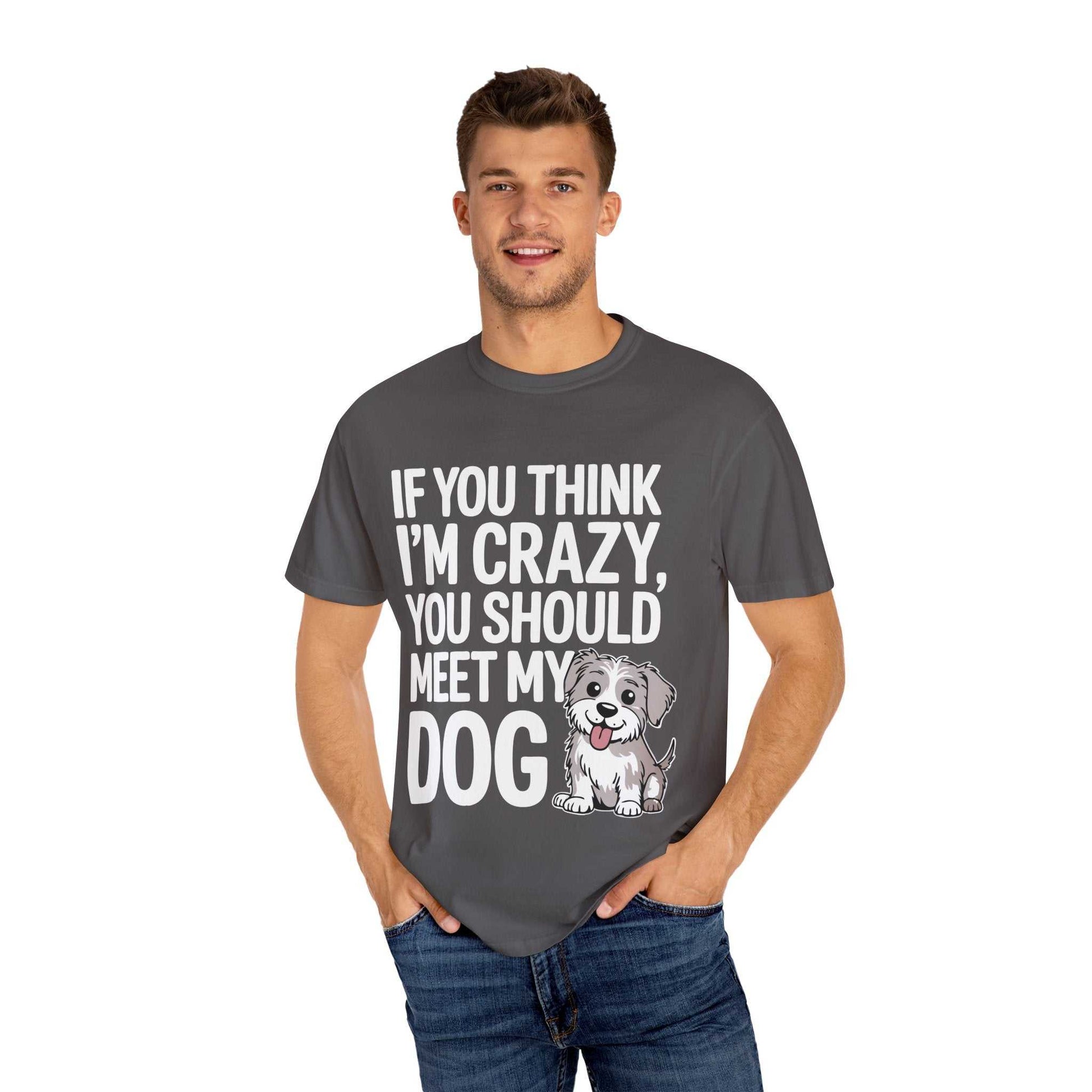 Man wearing a gray t-shirt with a dog graphic and text on a white background