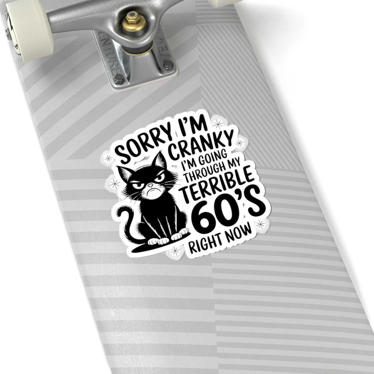 Sticker with a cat graphic and text on a skateboard deck