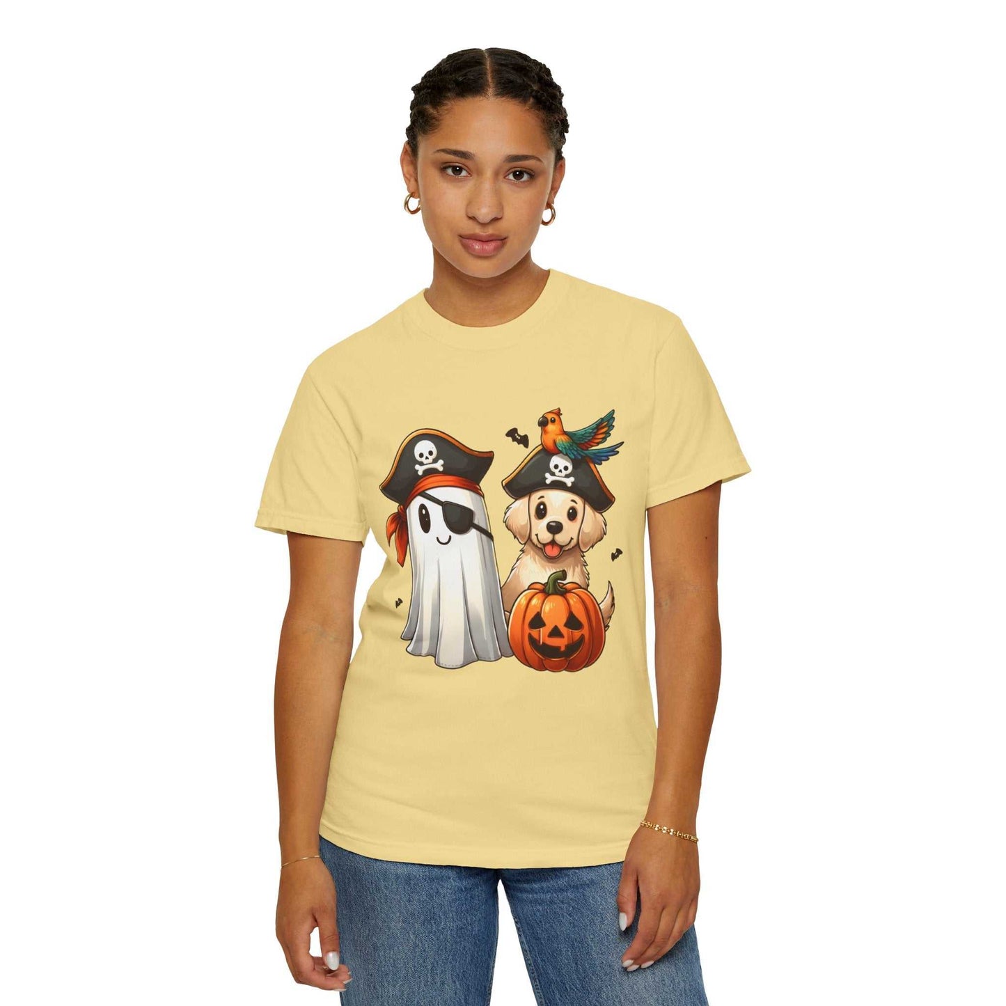 Person wearing a yellow t-shirt with Halloween-themed graphics on a white background