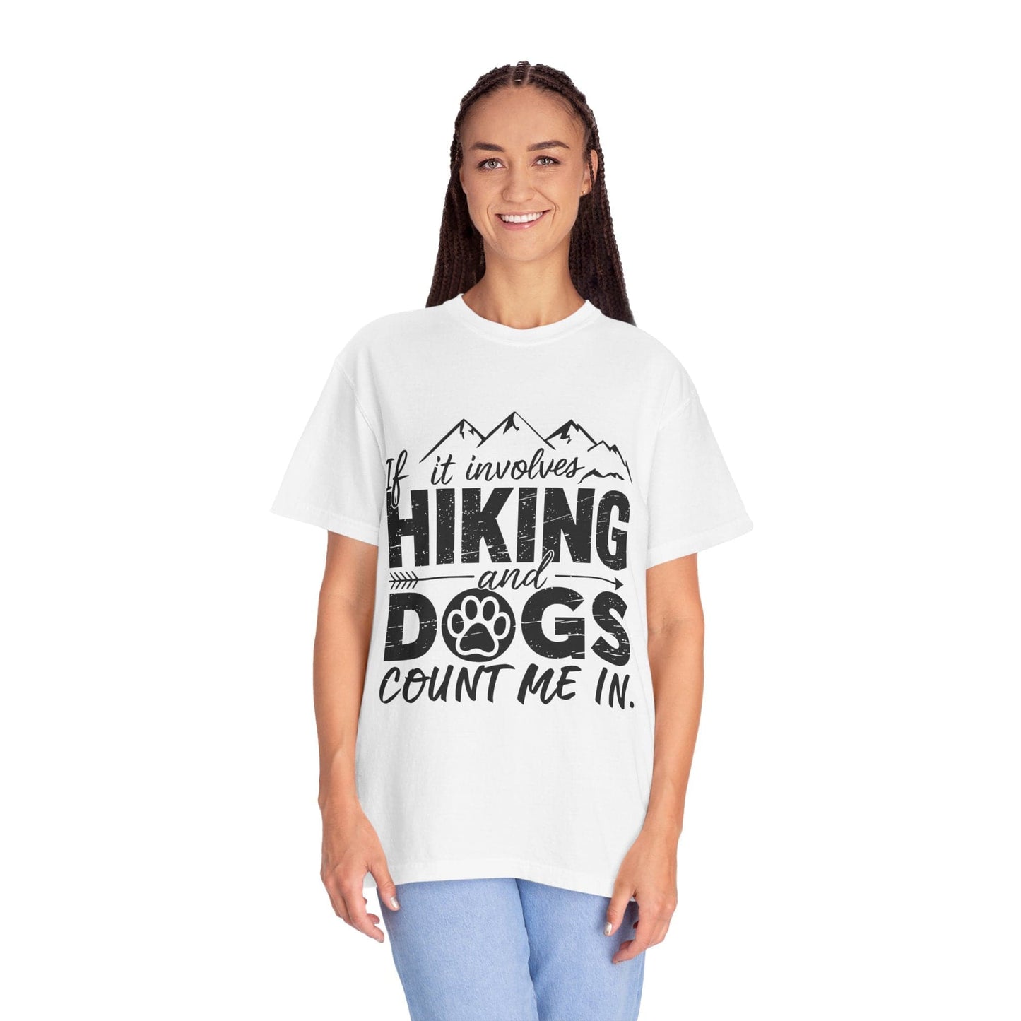 Person wearing a white t-shirt with 'Hiking and Dogs' text design on a white background