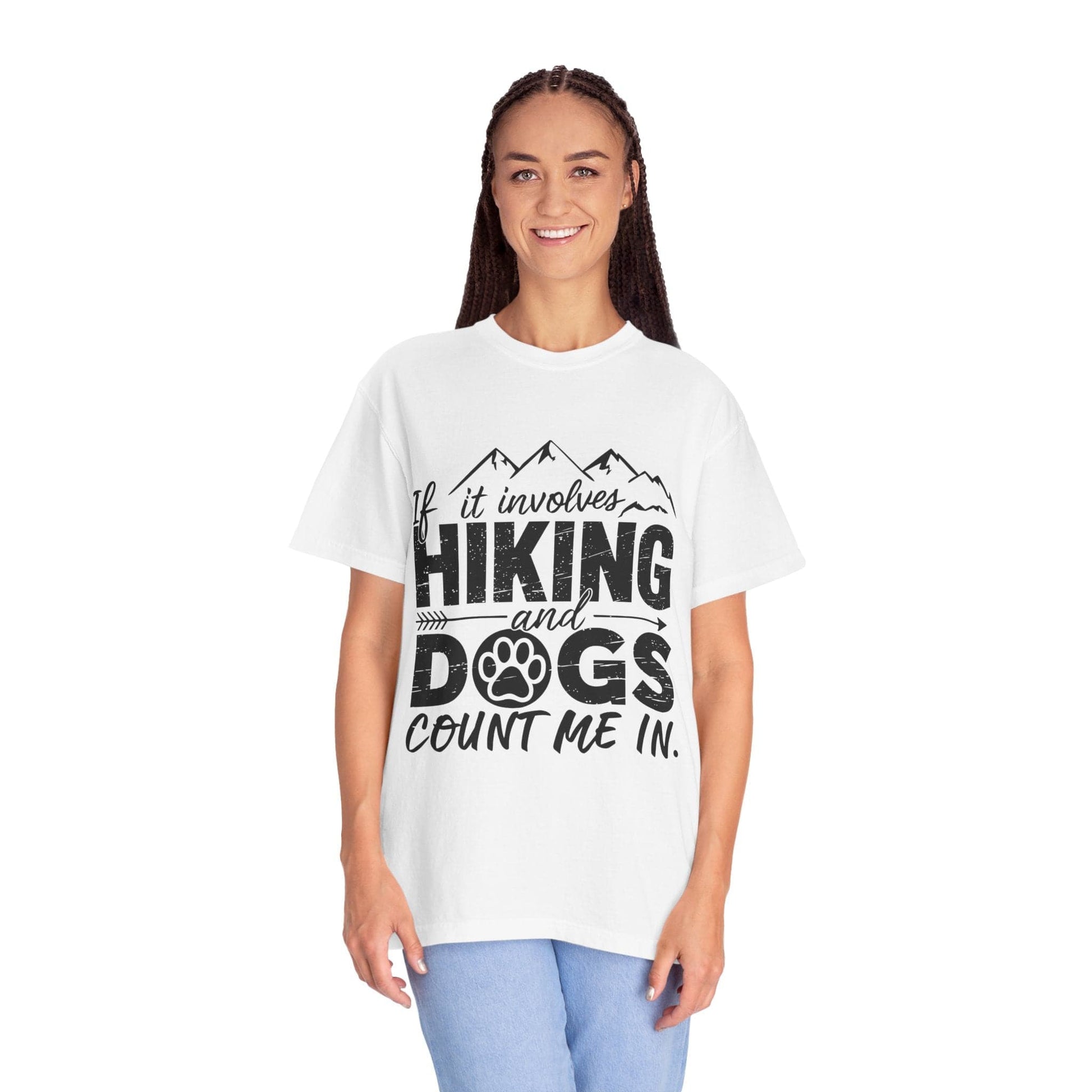 Person wearing a white t-shirt with 'Hiking and Dogs' text design on a white background