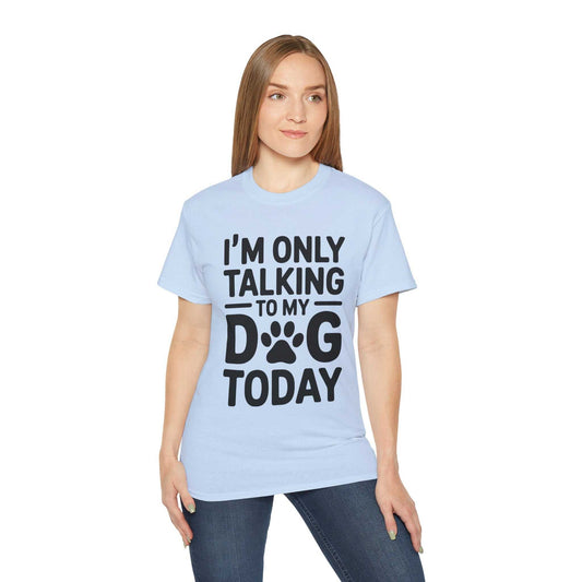 Person wearing a light blue t-shirt with text 'I'm only talking to my dog today' on a white background