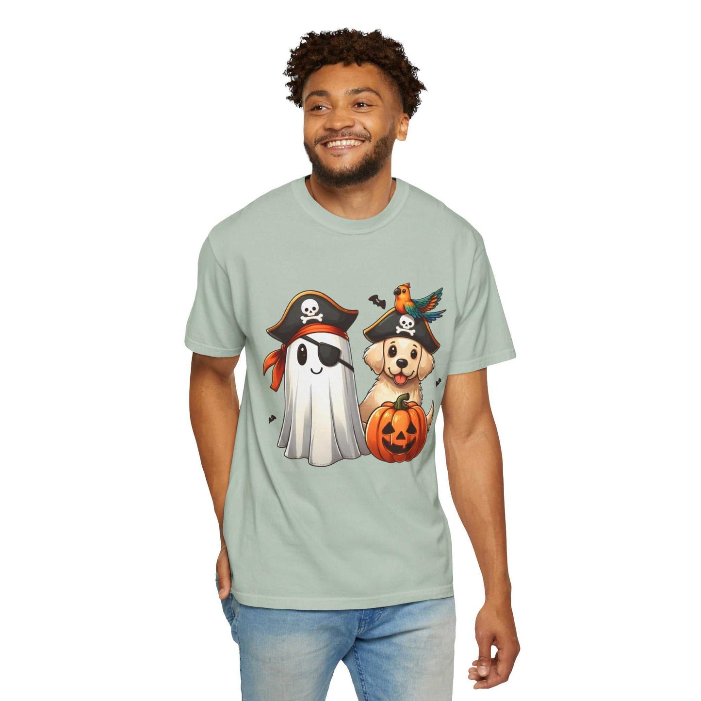 Man wearing a light green t-shirt with Halloween-themed graphics on a white background