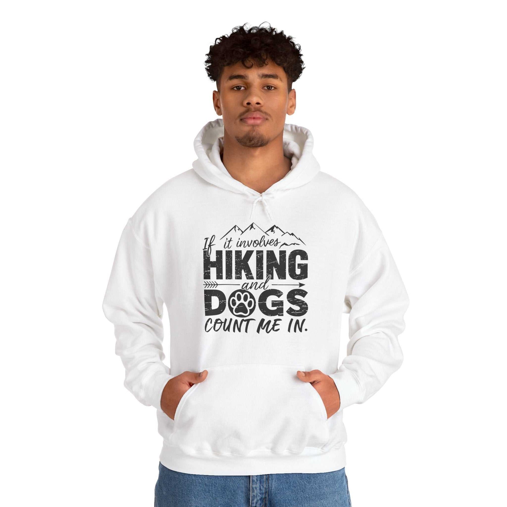 Person wearing a white hoodie with text 'If it involves hiking and dogs, count me in.' on a white background