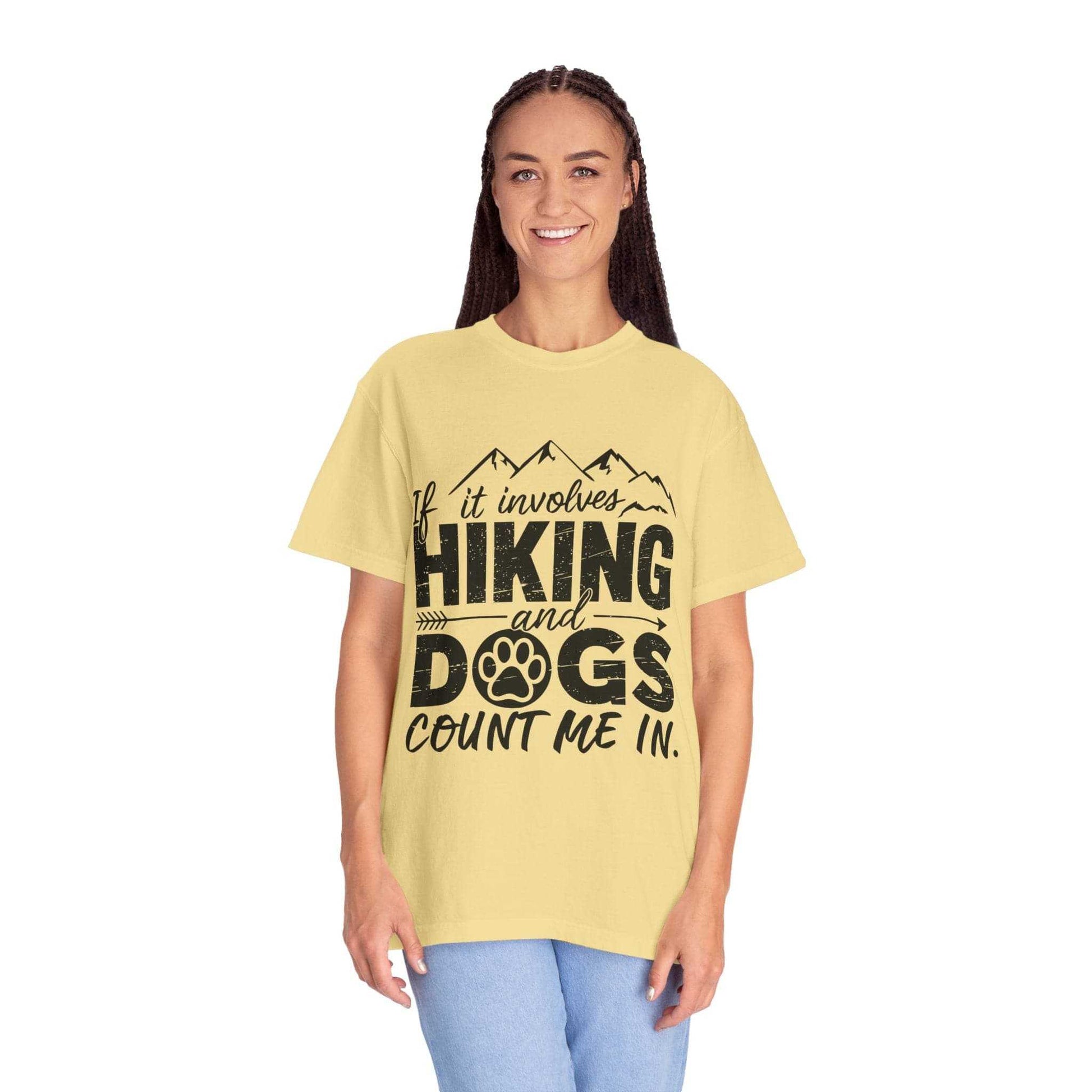 Woman wearing a yellow t-shirt with 'Hiking and Dogs' text design on a white background