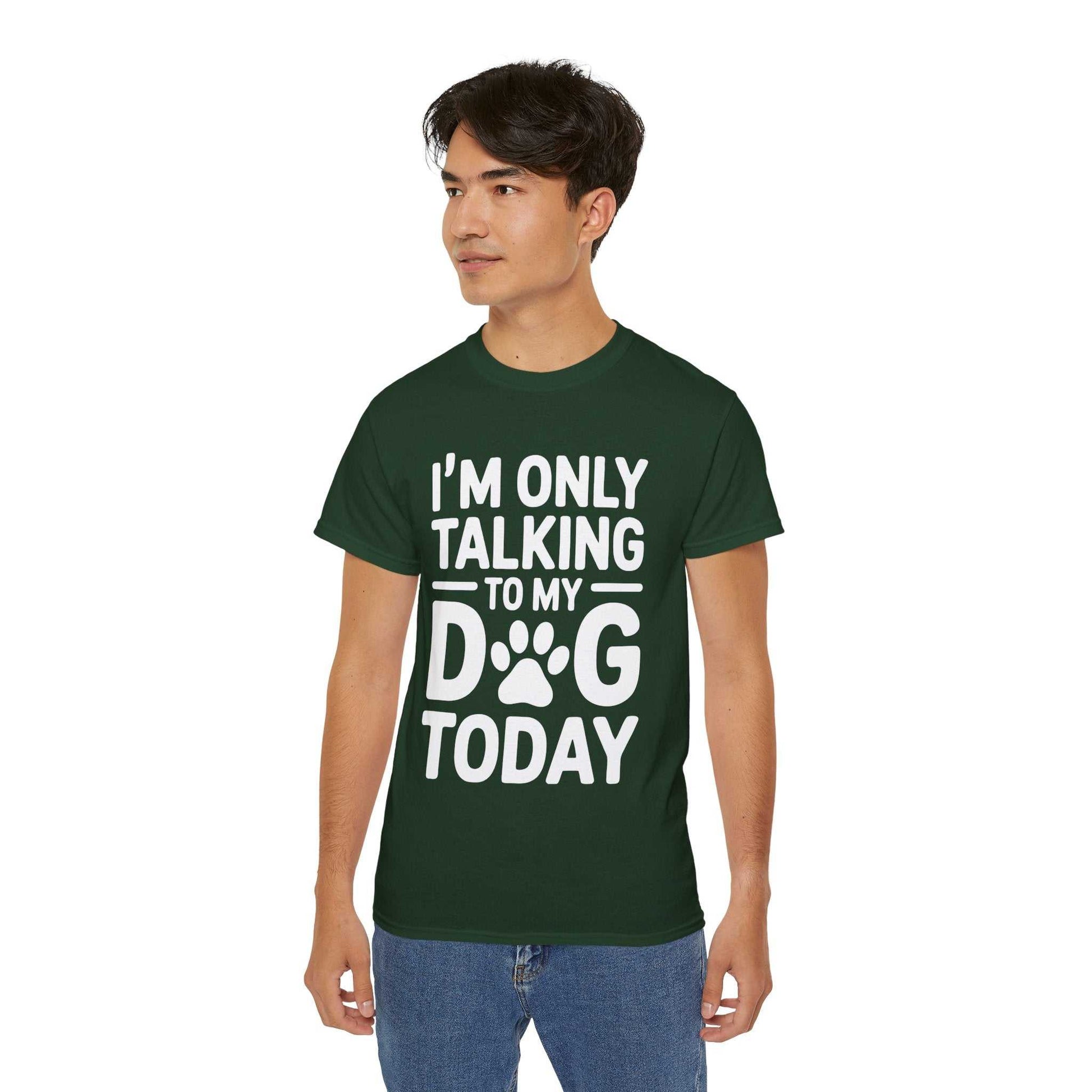 Person wearing a green t-shirt with text 'I'm only talking to my dog today' on a white background