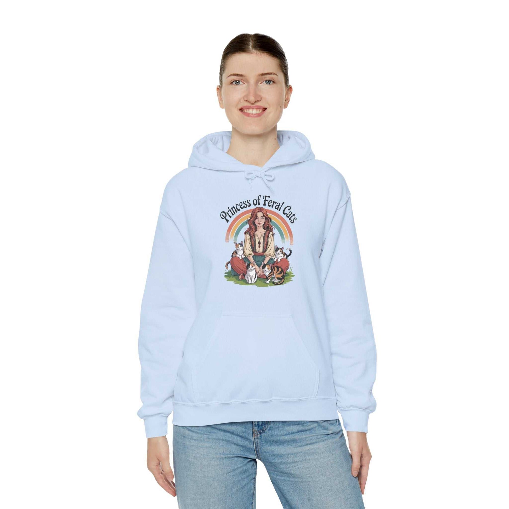 Person wearing a light blue hoodie with a graphic design on a white background