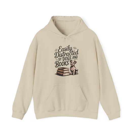 Beige hoodie with text 'Easily Distracted by Dogs and Books' and a dog illustration on a white background