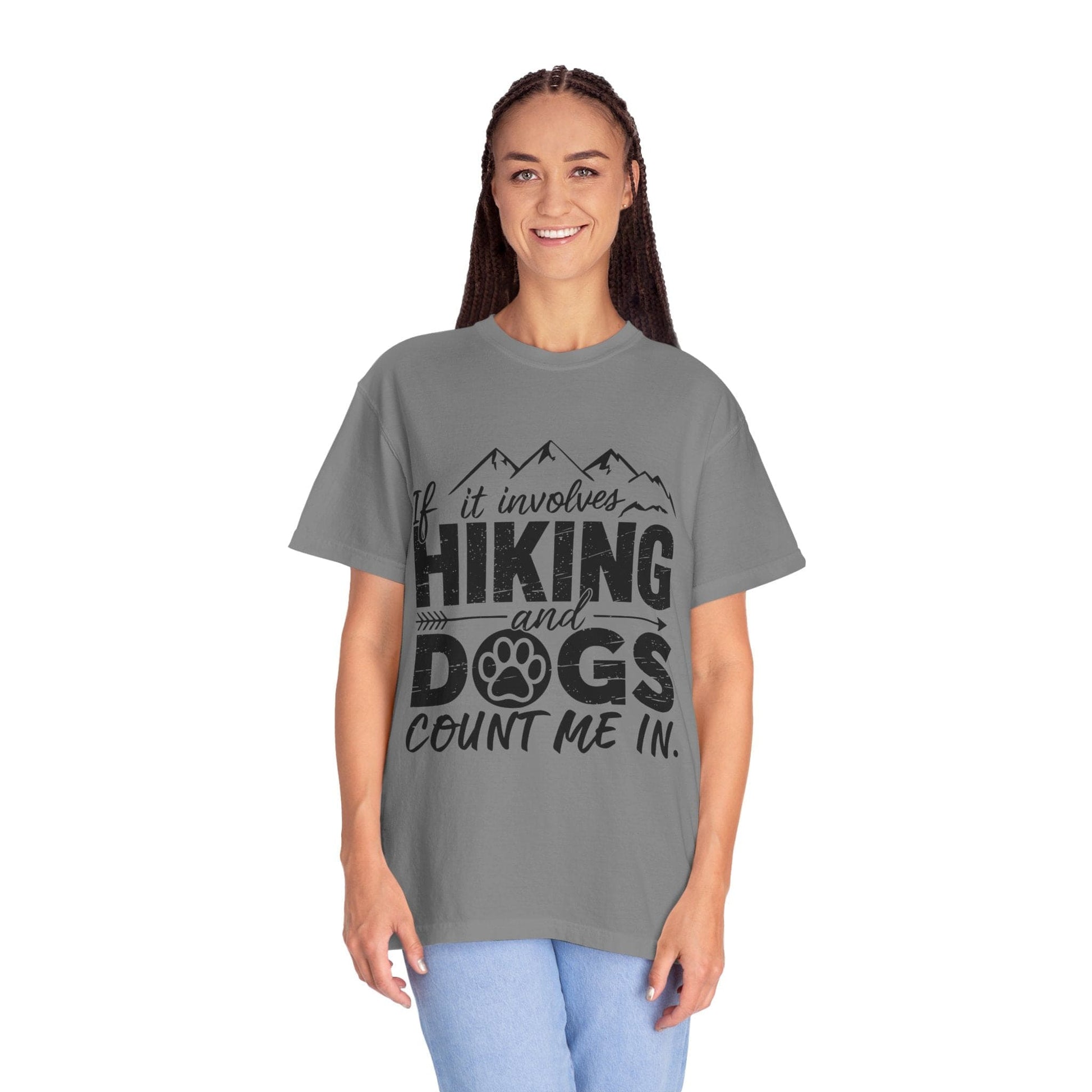 Person wearing a gray t-shirt with 'Hiking and Dogs' text design on a white background