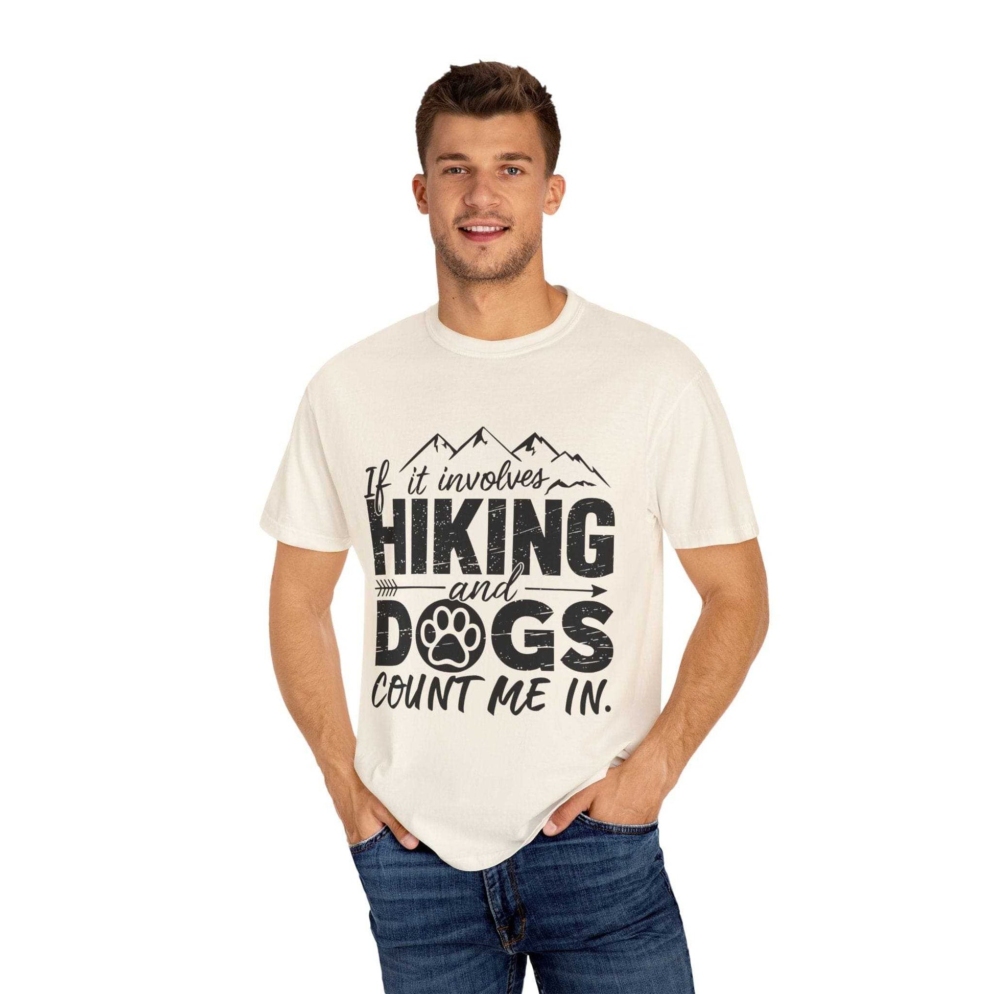 Man wearing a white t-shirt with 'Hiking and Dogs' text design on a white background