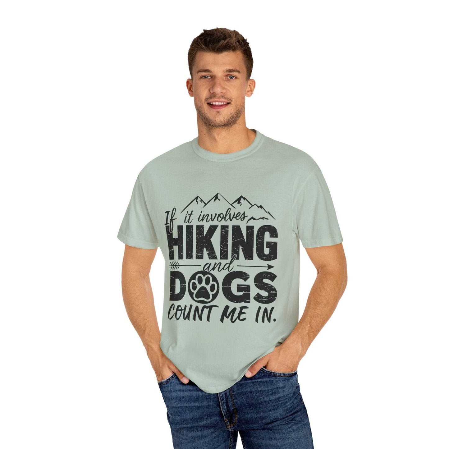 Man wearing a light green t-shirt with text 'If it involves hiking and dogs, count me in.' on a white background