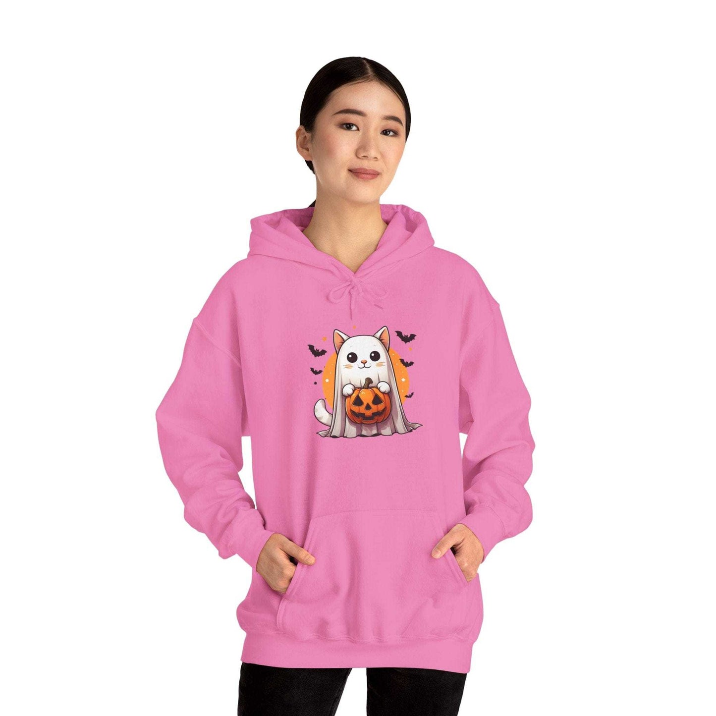 Person wearing a pink hoodie with a Halloween-themed design on a white background