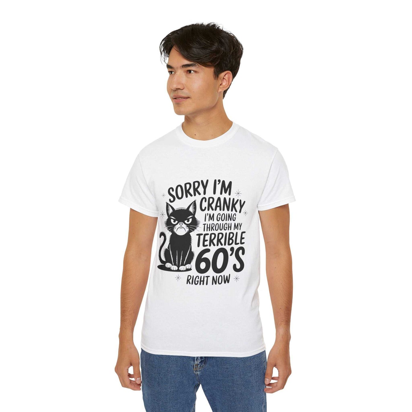 Person wearing a white t-shirt with a graphic and text, standing against a plain background