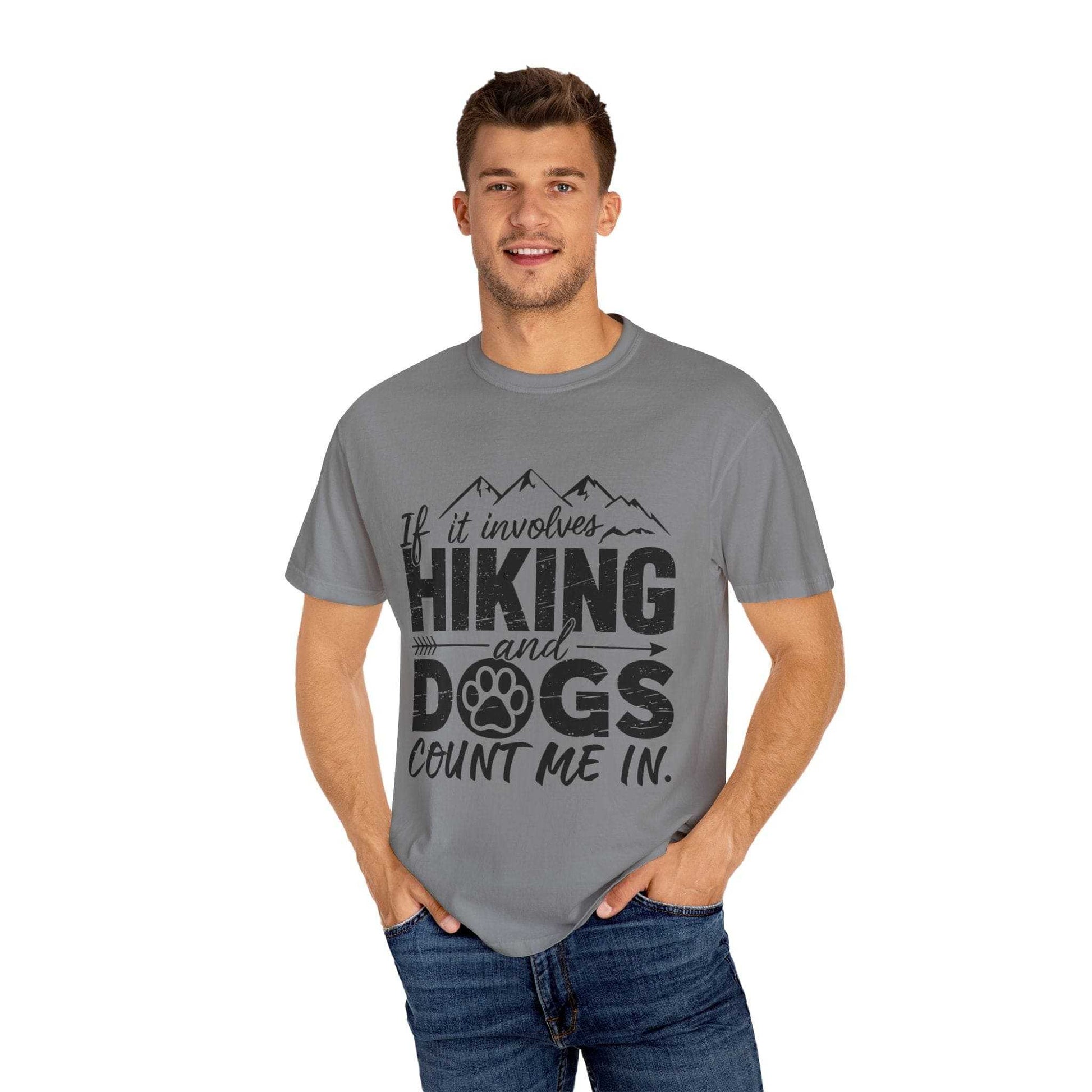 Man wearing a gray t-shirt with 'Hiking and Dogs' text design on a white background
