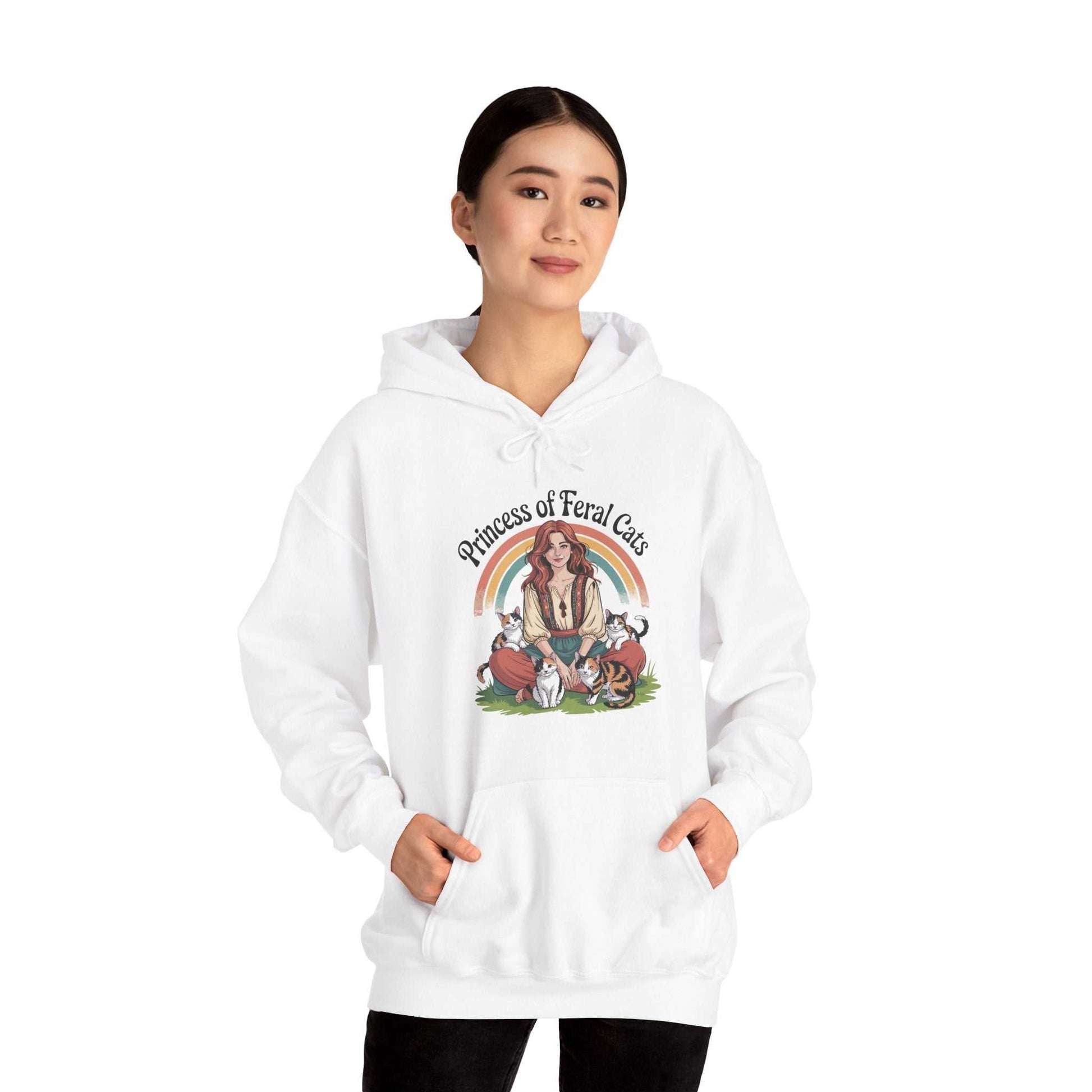 White hoodie with graphic design of a woman and cats on a white background