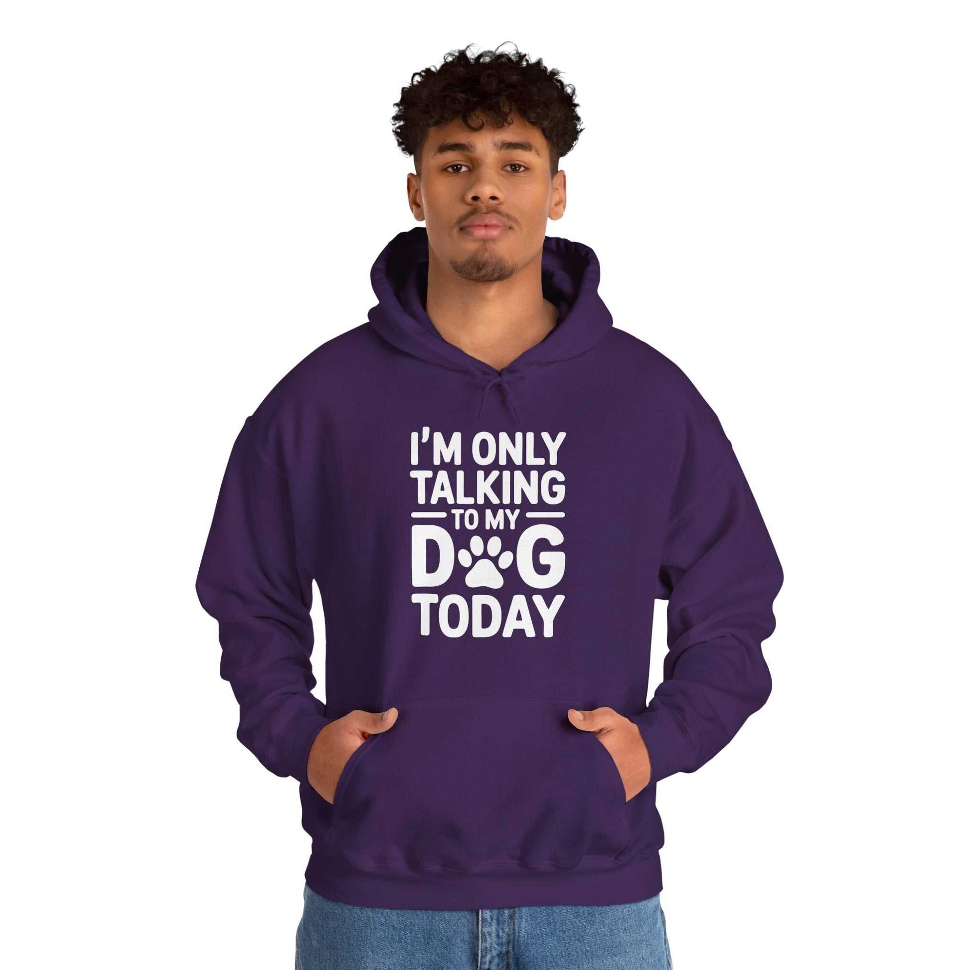 Person wearing a purple hoodie with text 'I'm only talking to my dog today' on a white background