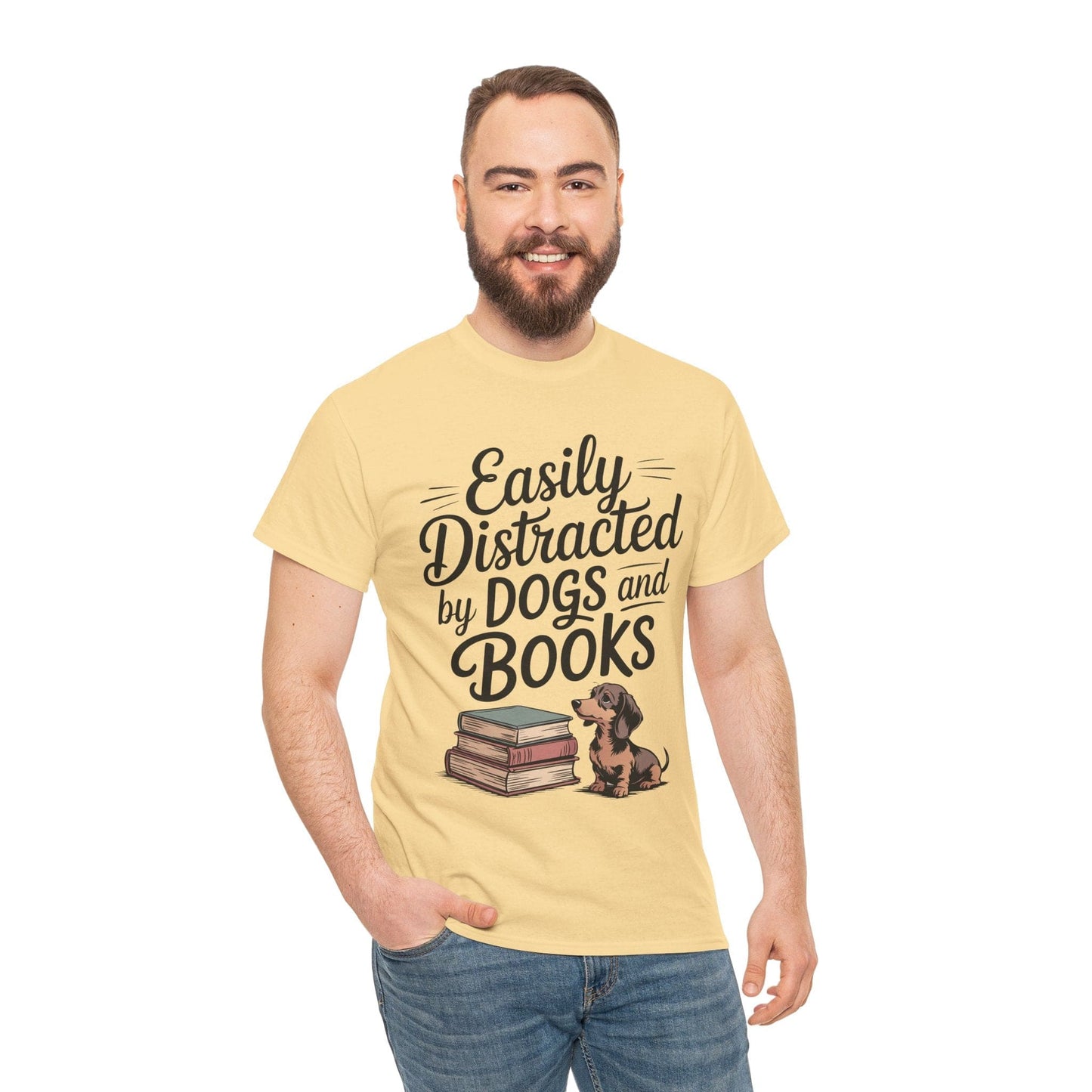Man wearing a yellow t-shirt with 'Easily Distracted by Dogs and Books' text and graphic.