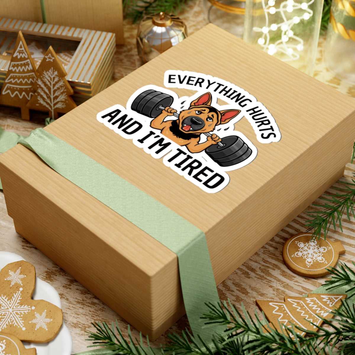 Wooden gift box with a humorous dog sticker and Christmas-themed decorations.