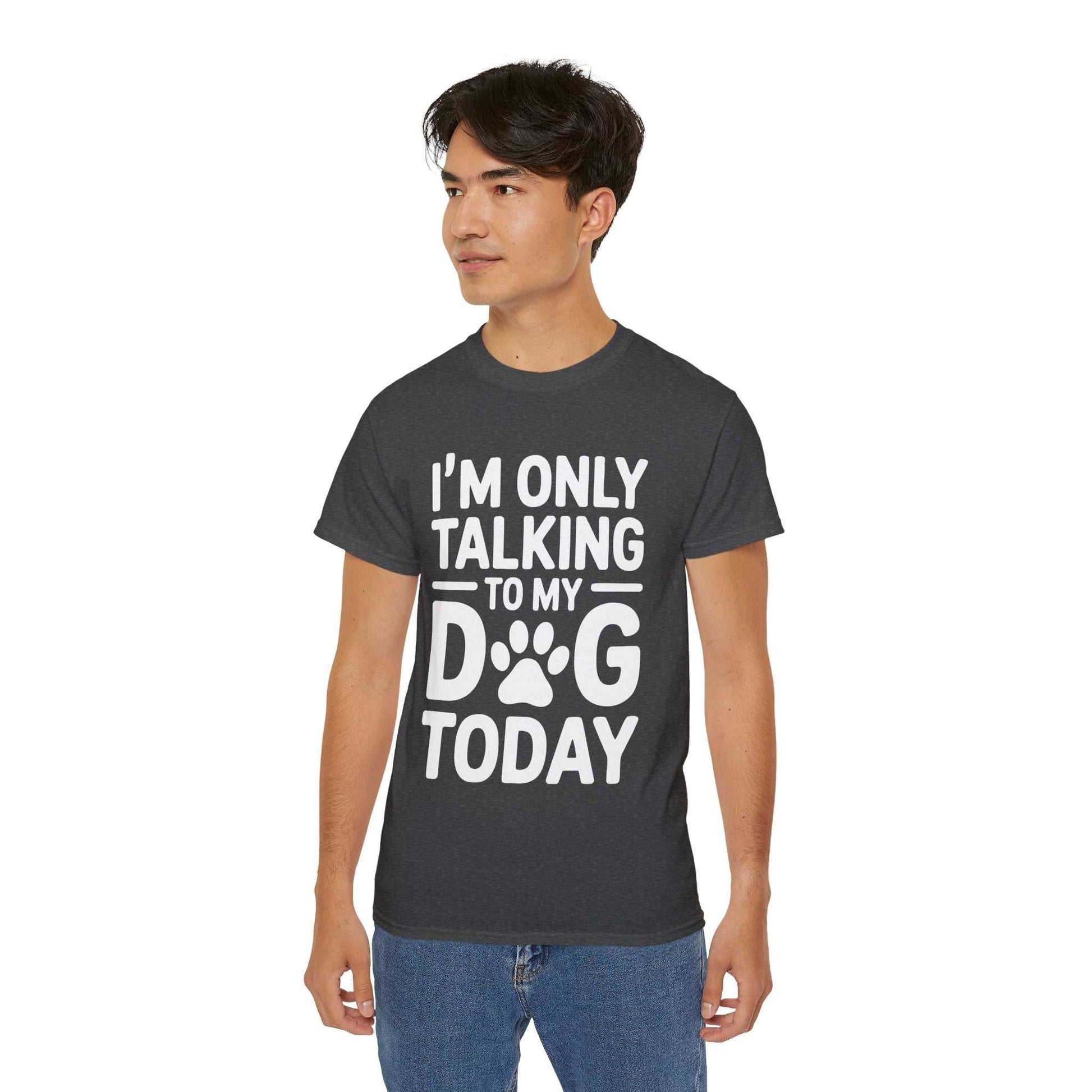 Person wearing a dark gray t-shirt with 'I'm only talking to my dog today' text on a white background