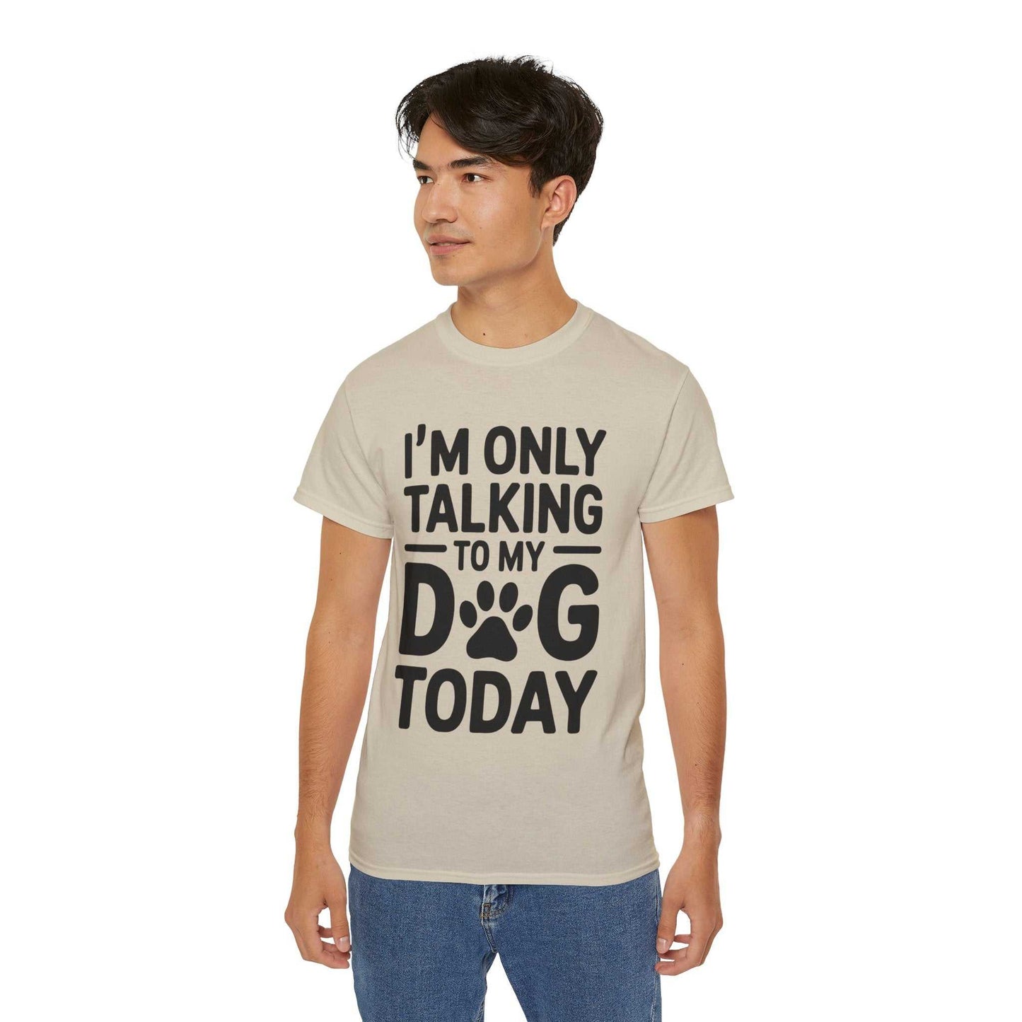 Person wearing a beige t-shirt with text 'I'm only talking to my dog today' on a white background