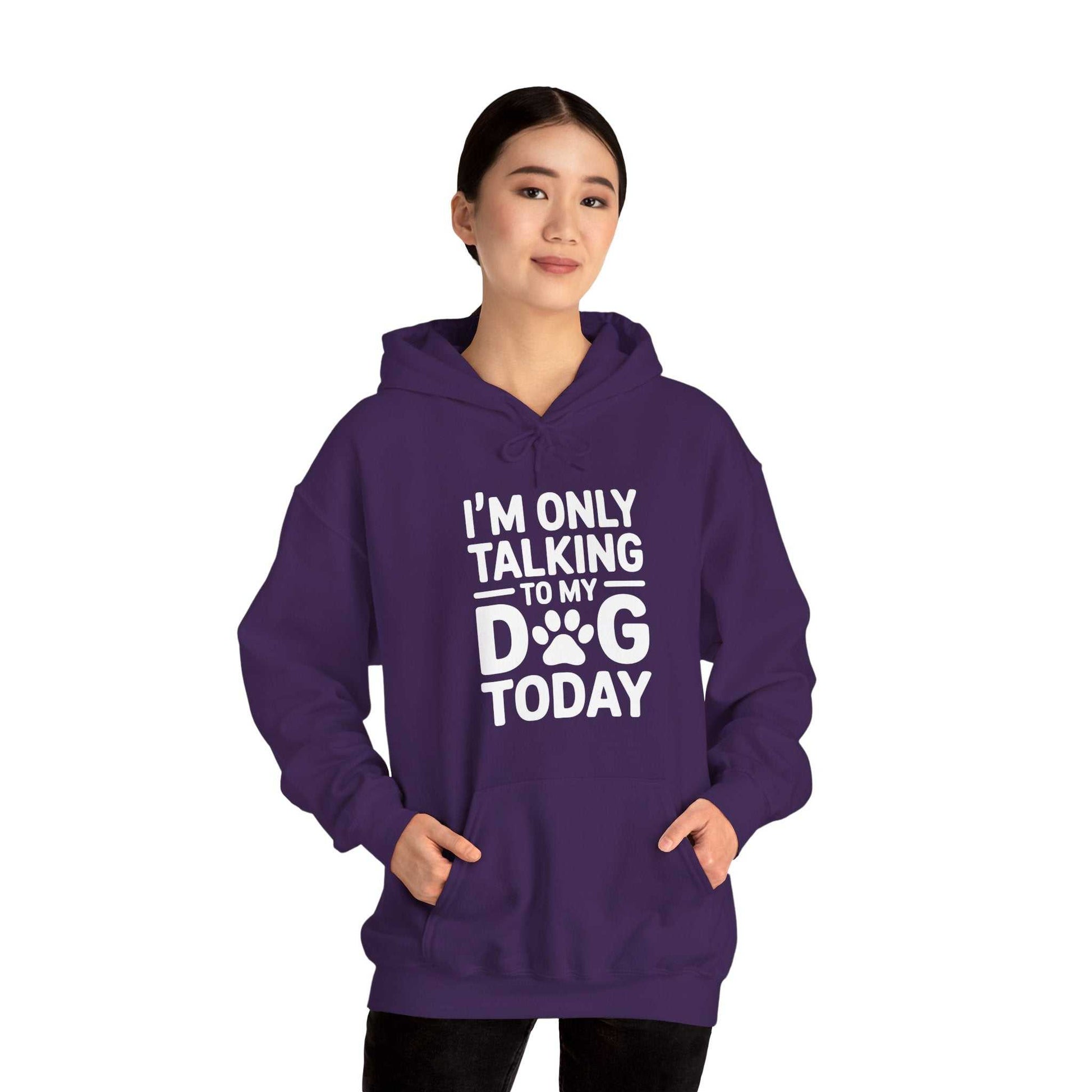 Person wearing a purple hoodie with text 'I'm only talking to my dog today' on a white background