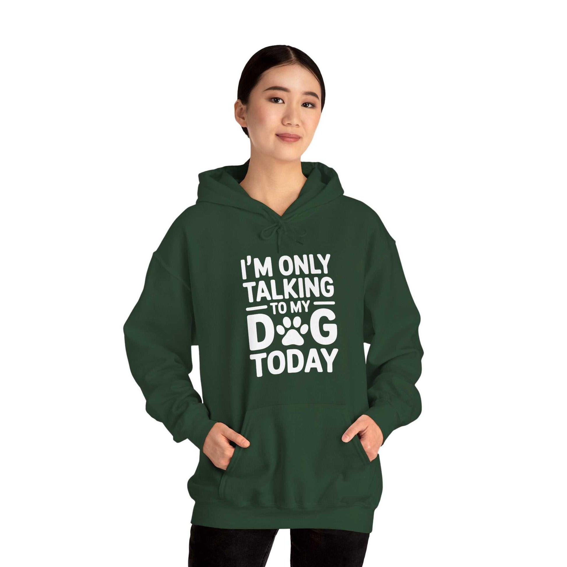 Person wearing a green hoodie with text 'I'm only talking to my dog today' on a white background