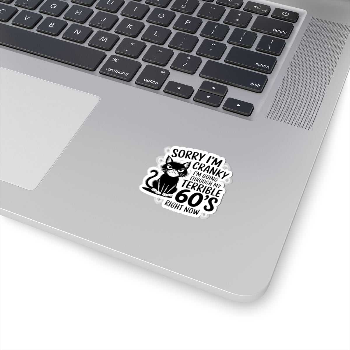 Laptop with a sticker on the palm rest area