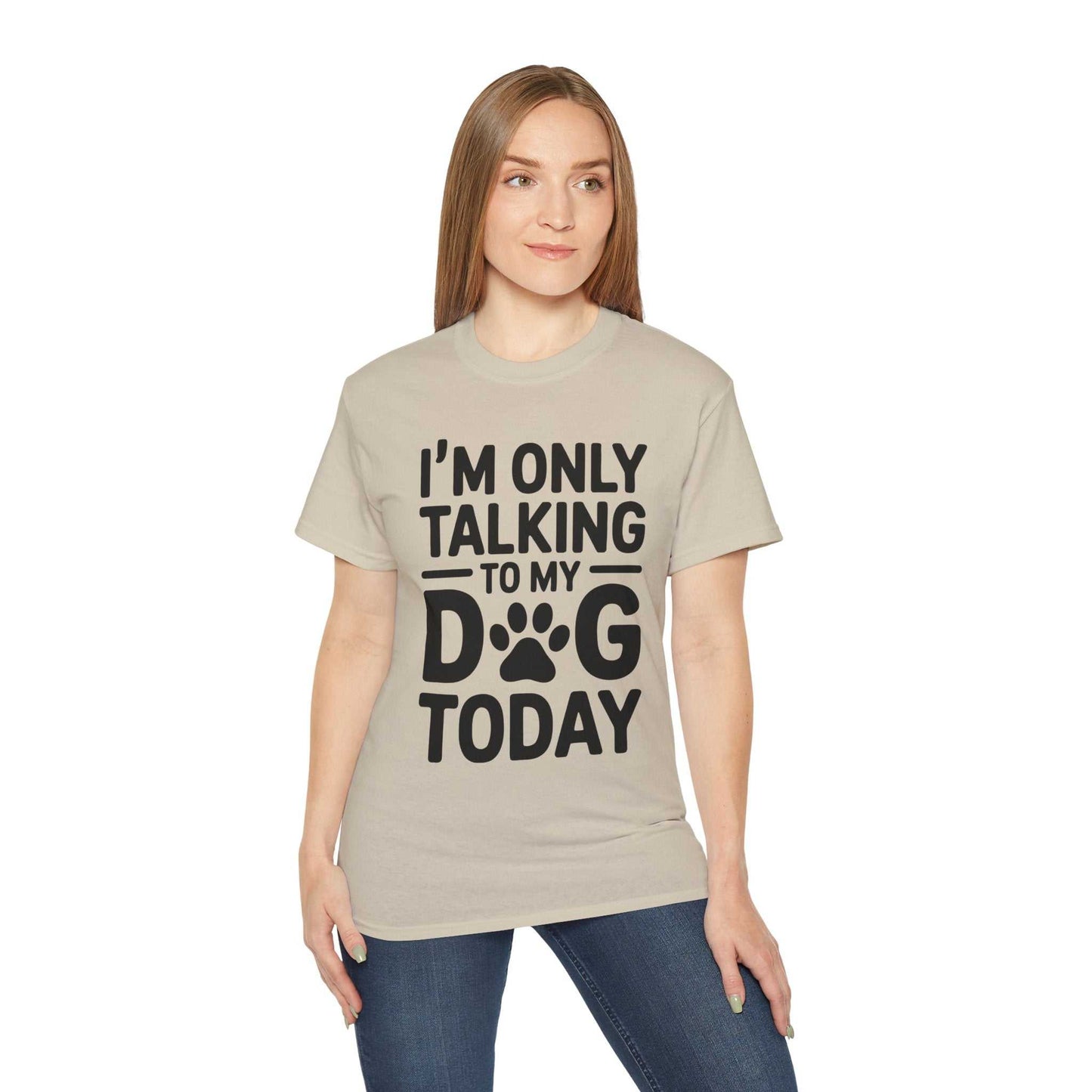Woman wearing a beige t-shirt with text 'I'm only talking to my dog today' on a white background