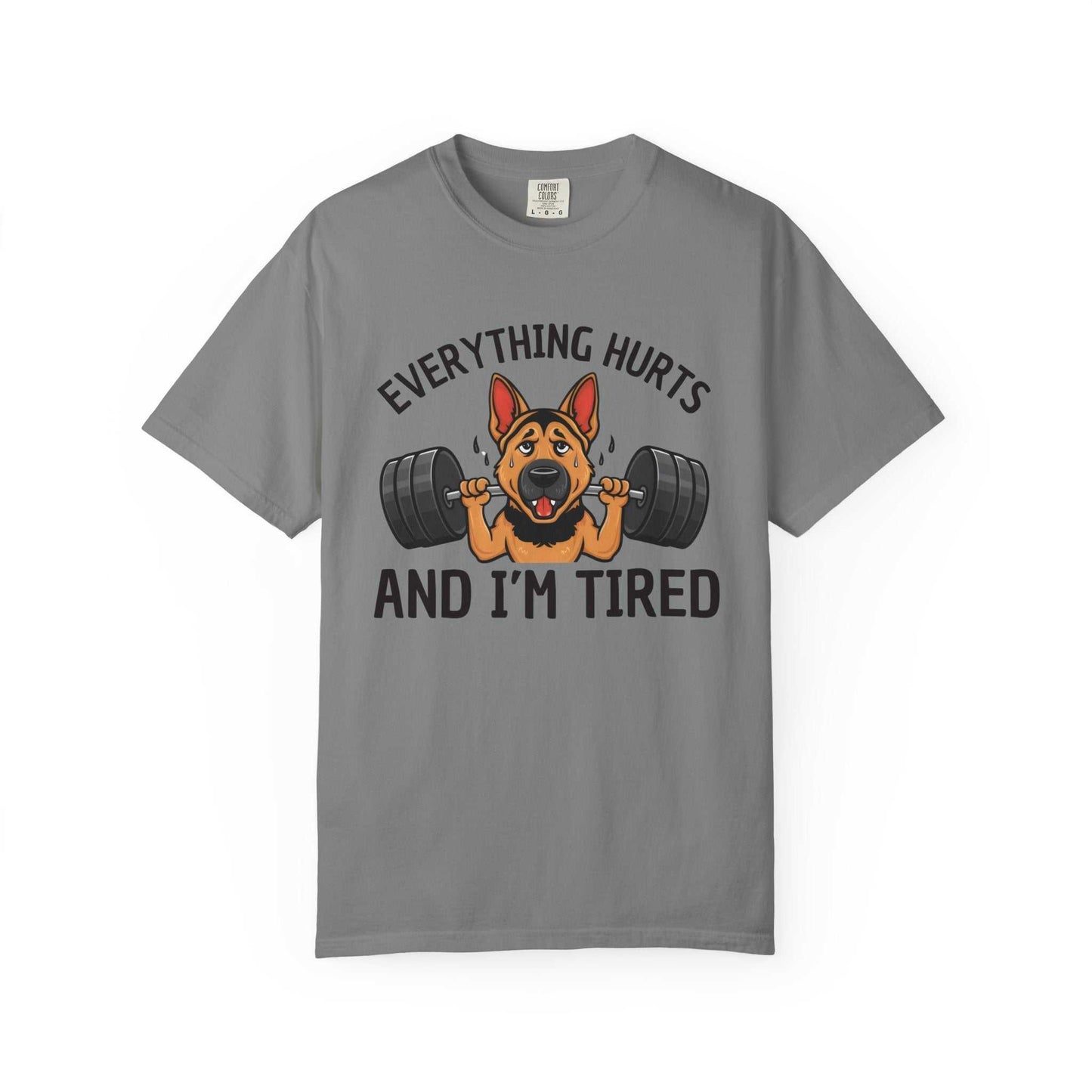 Gray t-shirt with a dog lifting weights graphic and text 'Everything hurts and I'm tired' on a white background