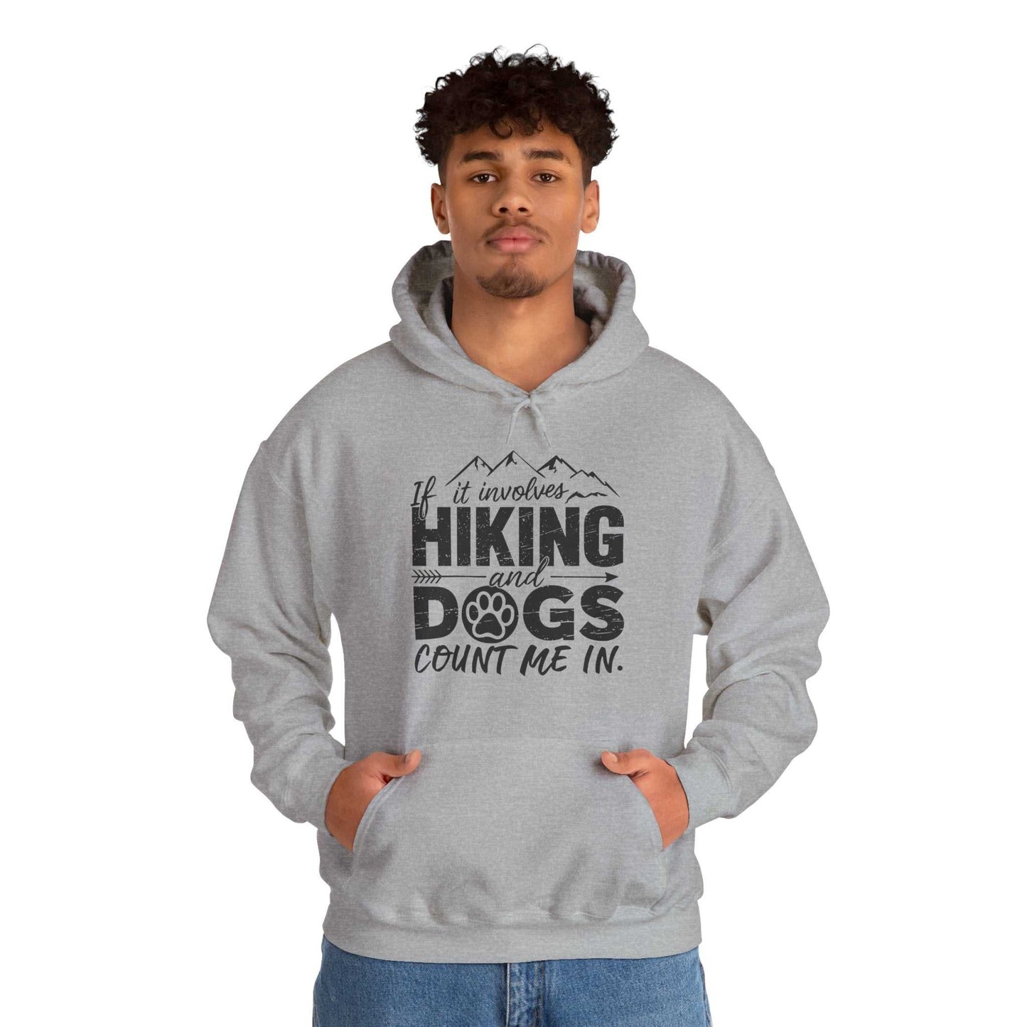 Person wearing a gray hoodie with text 'If it involves hiking and dogs, count me in' on a white background