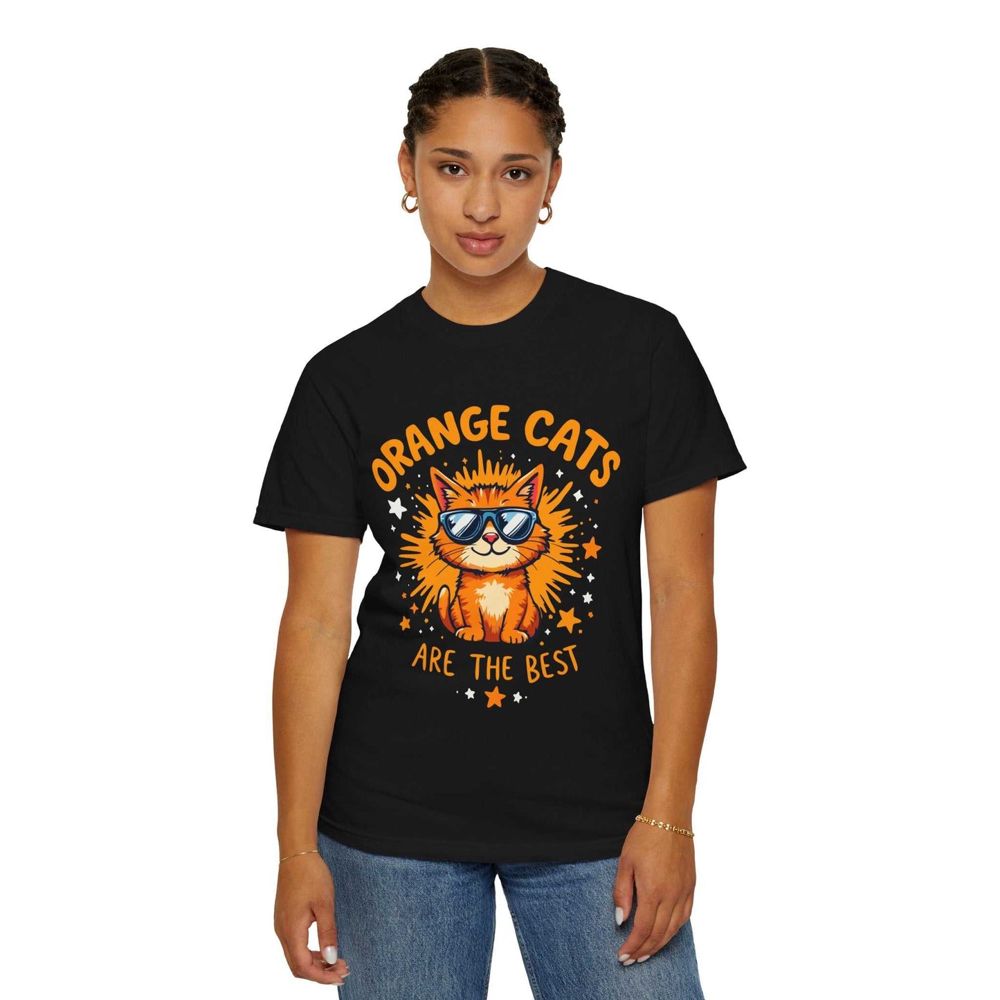 Person wearing a black t-shirt with an orange cat graphic and text on a white background