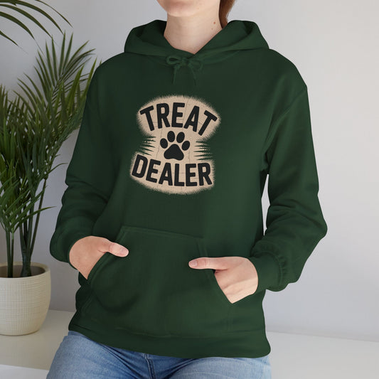 Person wearing a green hoodie with 'Treat Dealer' design, standing indoors next to a plant.