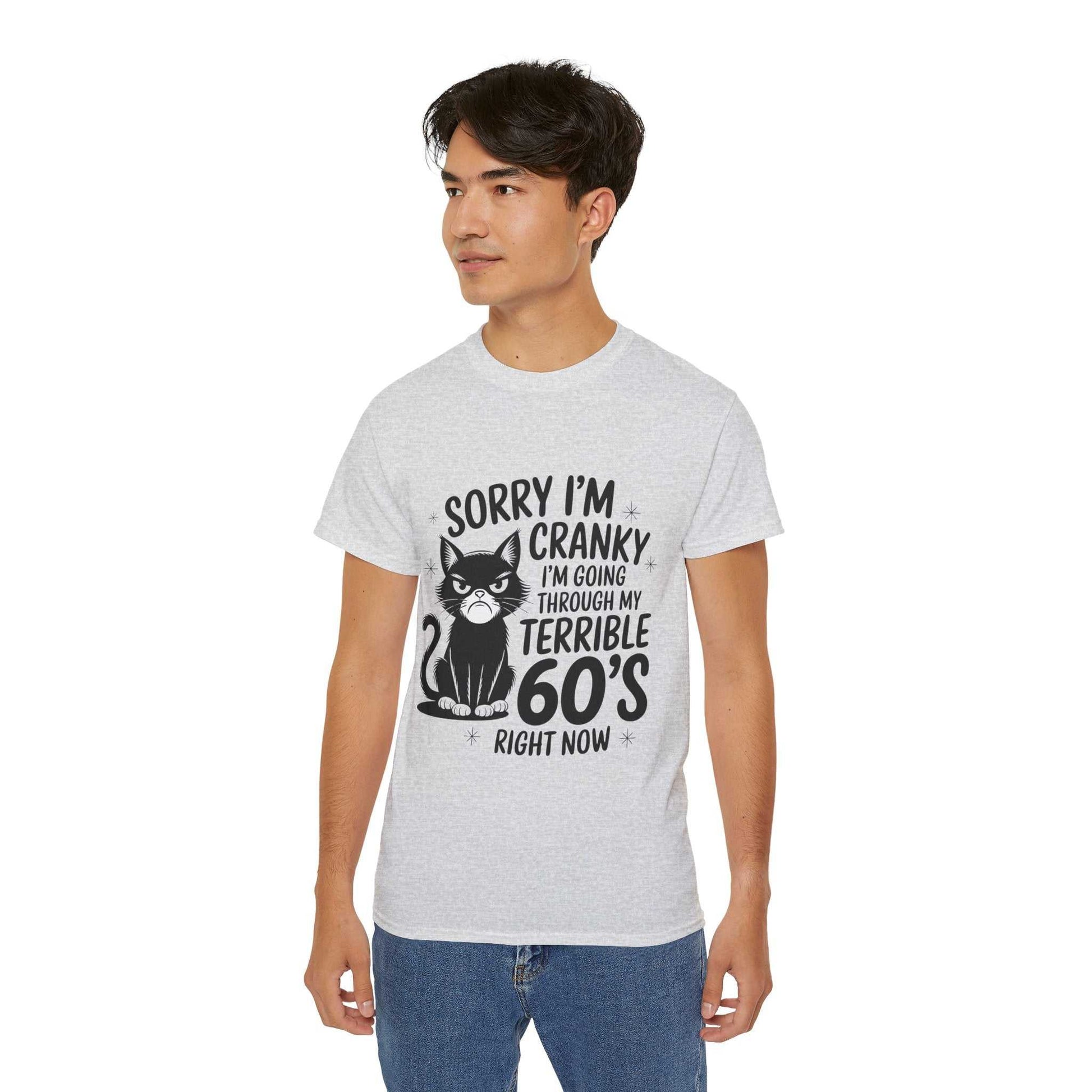 Person wearing a gray t-shirt with a graphic and text on a white background