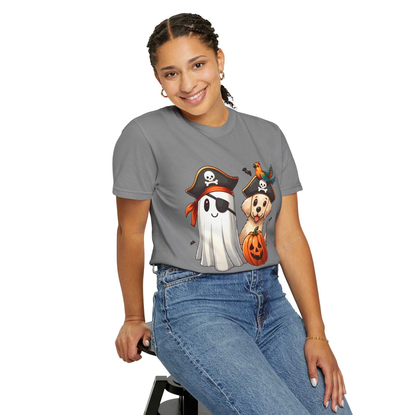 Person wearing a gray t-shirt with Halloween-themed graphics on a white background
