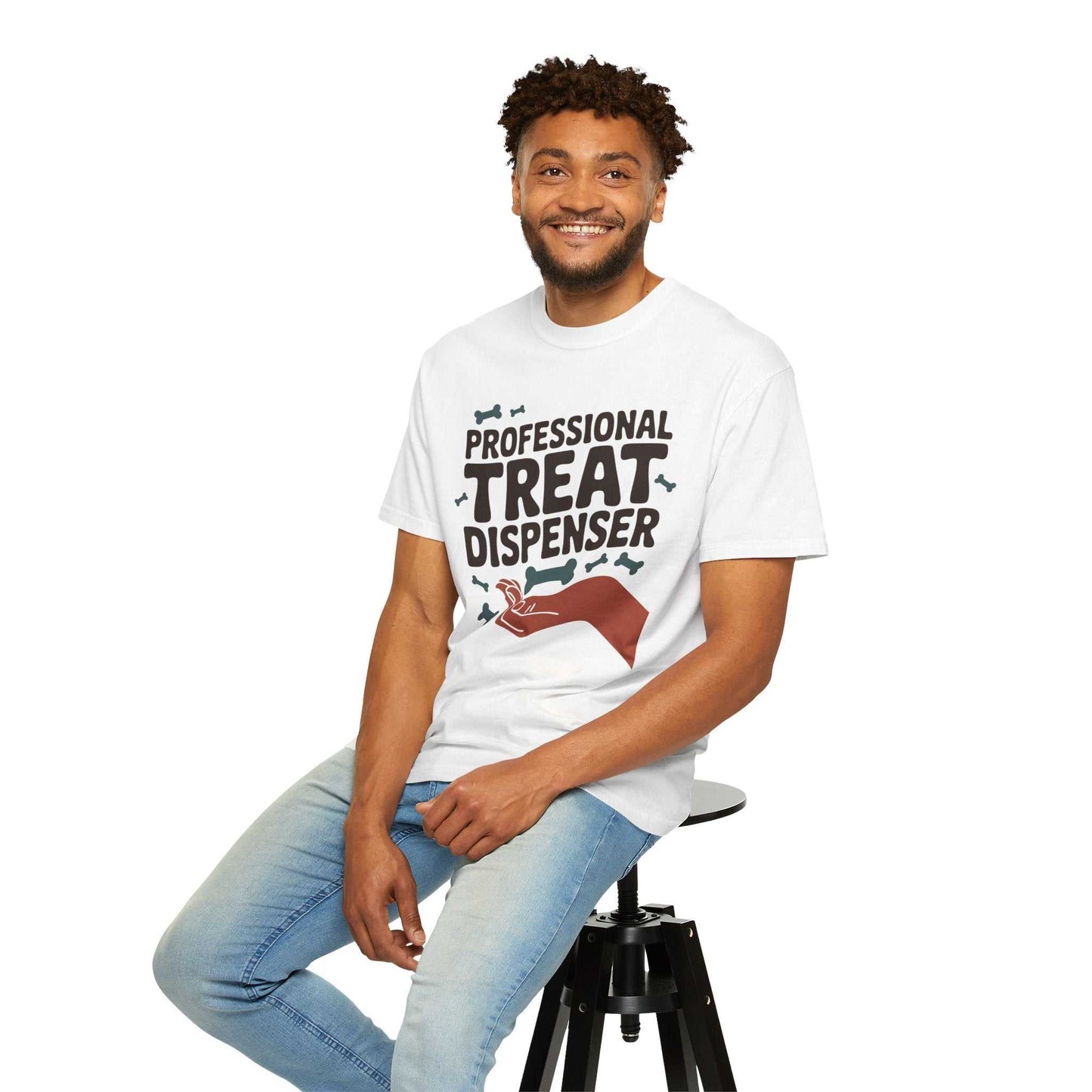 Man wearing a white t-shirt with text and graphics, sitting on a stool against a white background