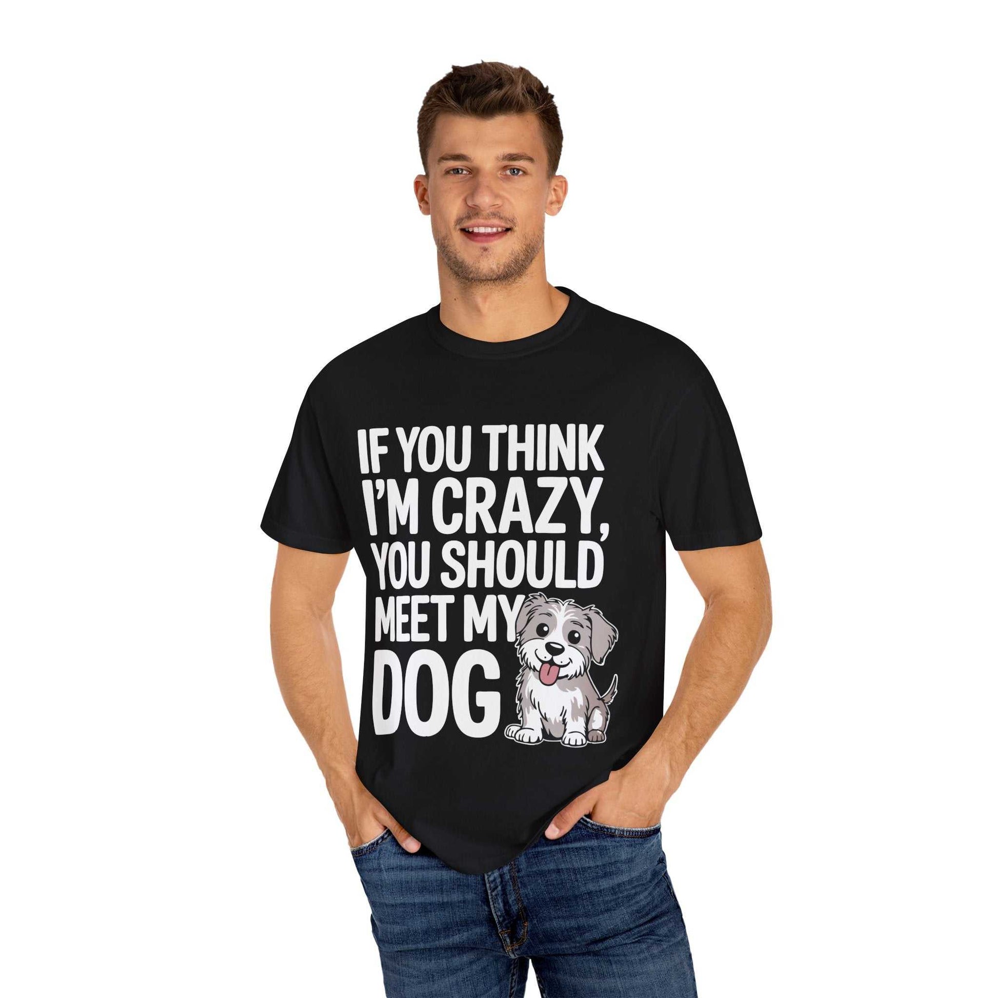 Man wearing a black t-shirt with a humorous dog-themed message on a white background