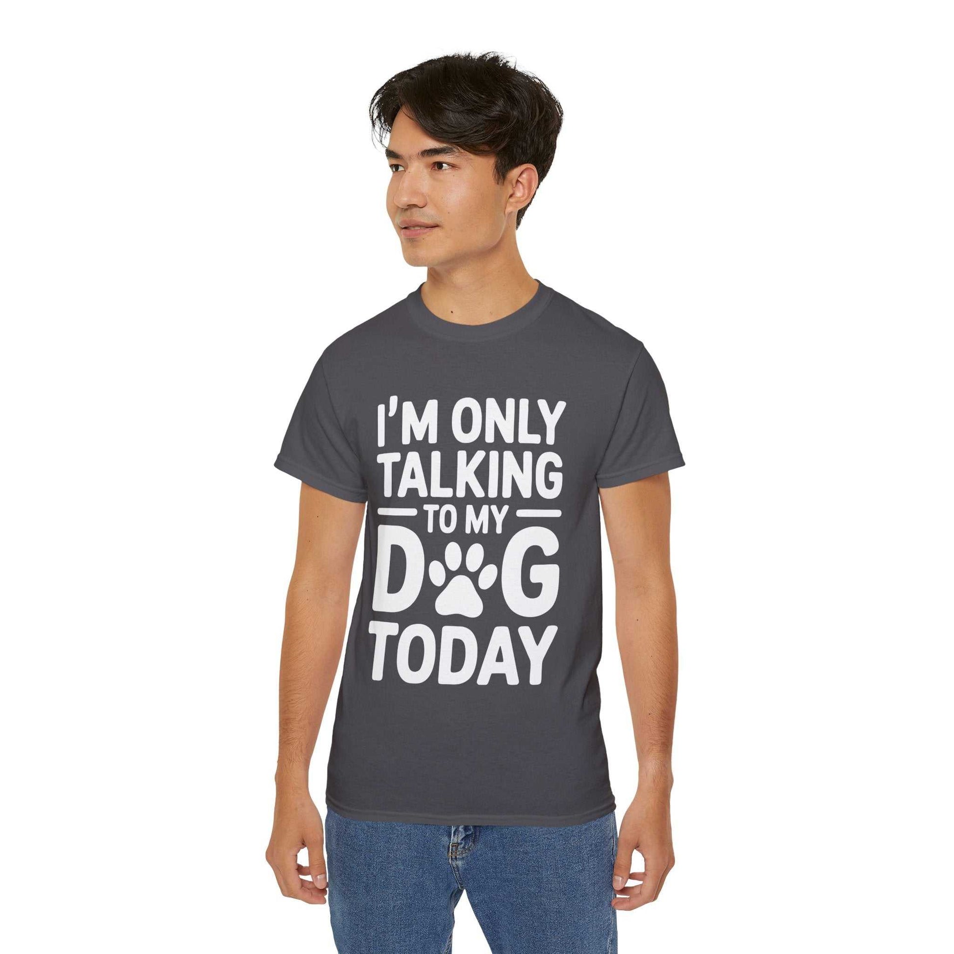 Person wearing a dark gray t-shirt with 'I'm only talking to my dog today' text on a white background