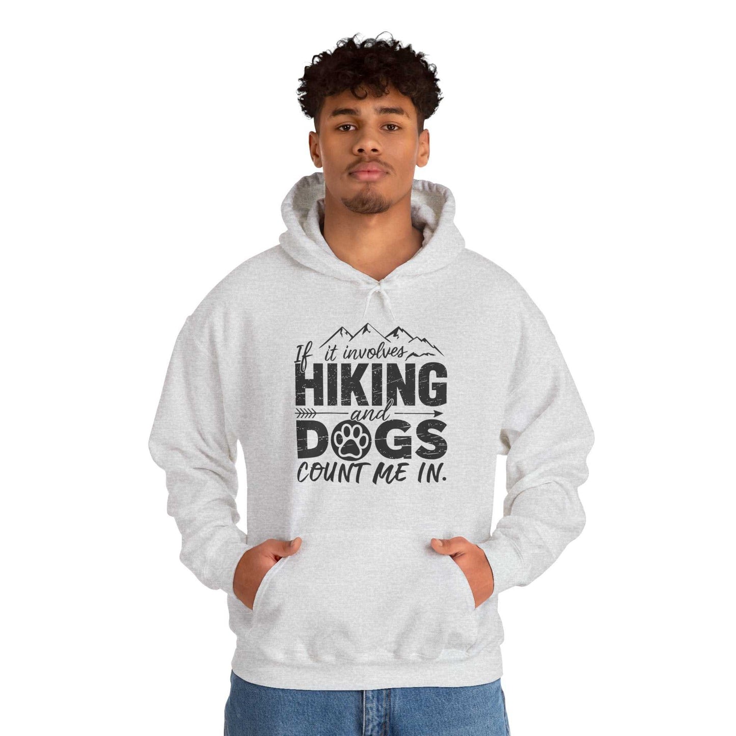 Person wearing a hoodie with 'If it involves hiking and dogs, count me in' text on a white background
