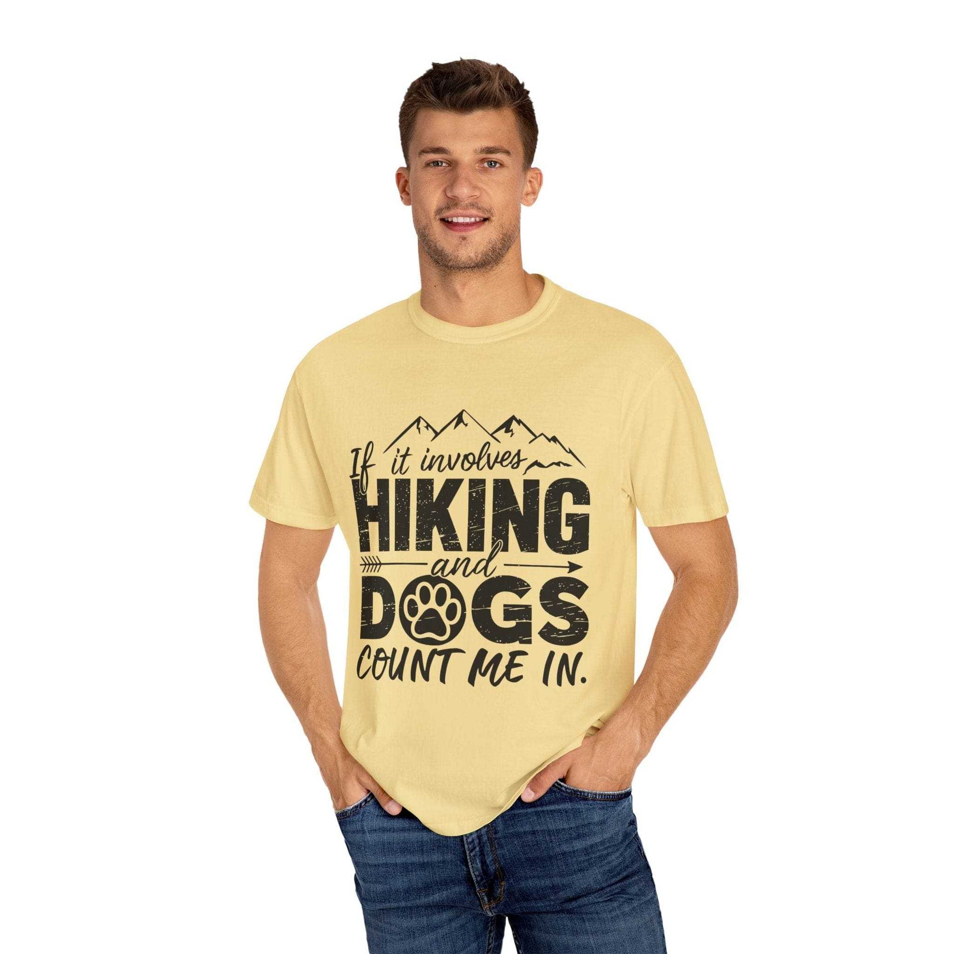 Man wearing a yellow t-shirt with 'Hiking and Dogs' text design on a white background