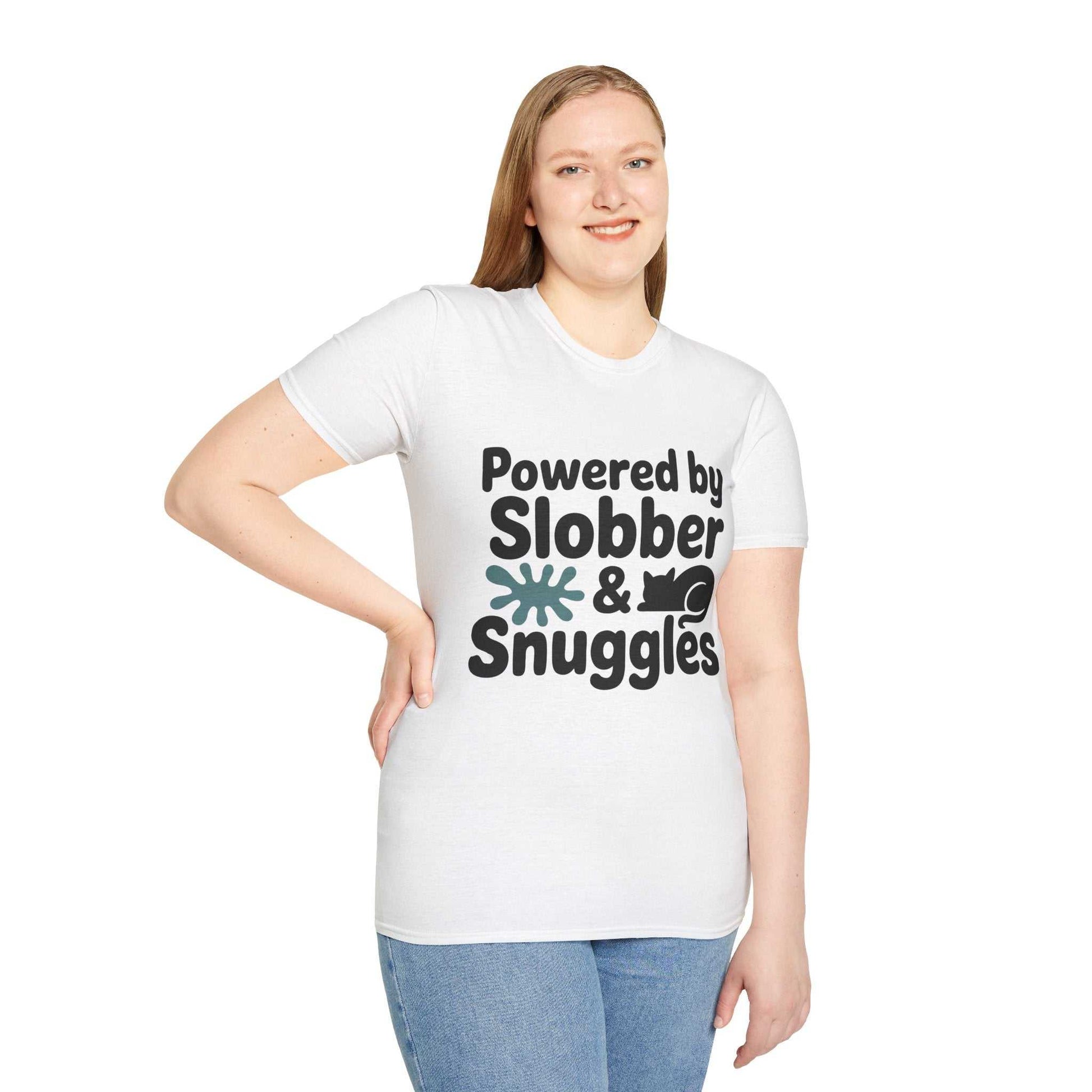Person wearing a white t-shirt with 'Powered by Slobber & Snuggles' text on a white background