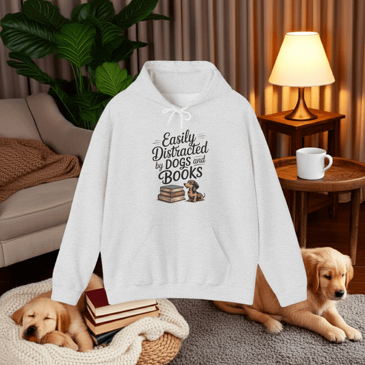 White hoodie with text and dog illustrations in a cozy living room setting.